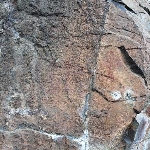 Recorded panel: heavily weathered dark rock